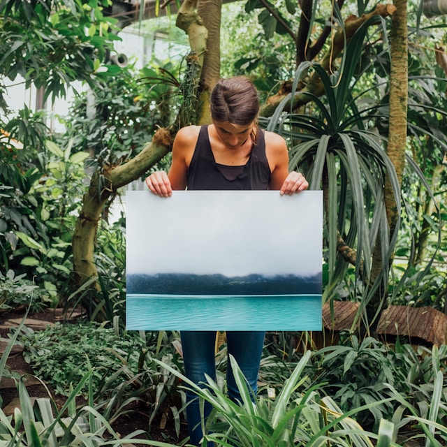 girl holding canvas in hands